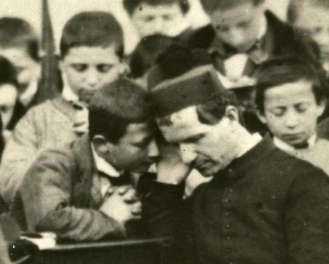 San Juan Bosco confesando